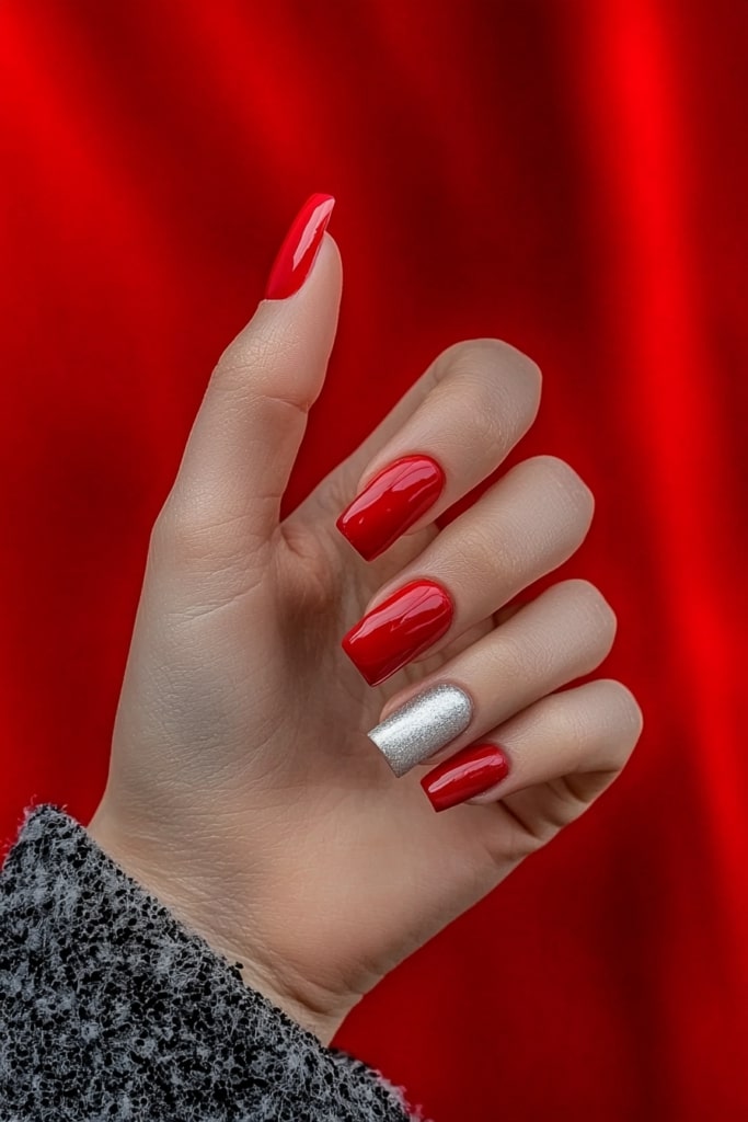 Pink and white Christmas nails with single silver accent nail