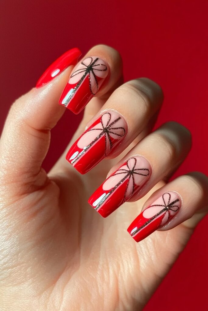 Pink and red Christmas nails with glittery bow designs