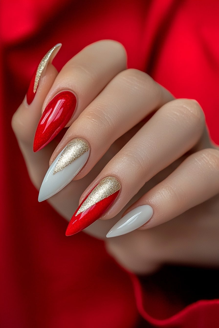 Christmas stiletto nails with red, white and gold elegant design