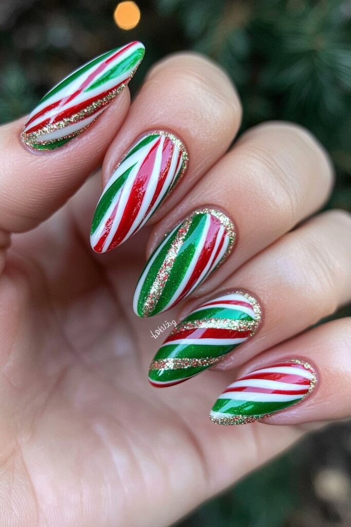 Red and green Christmas nail designs with candy cane stripes