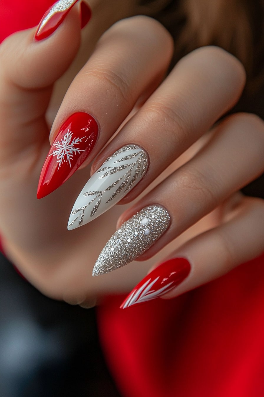 Simple Christmas nails featuring red snowflakes and silver glitter accents