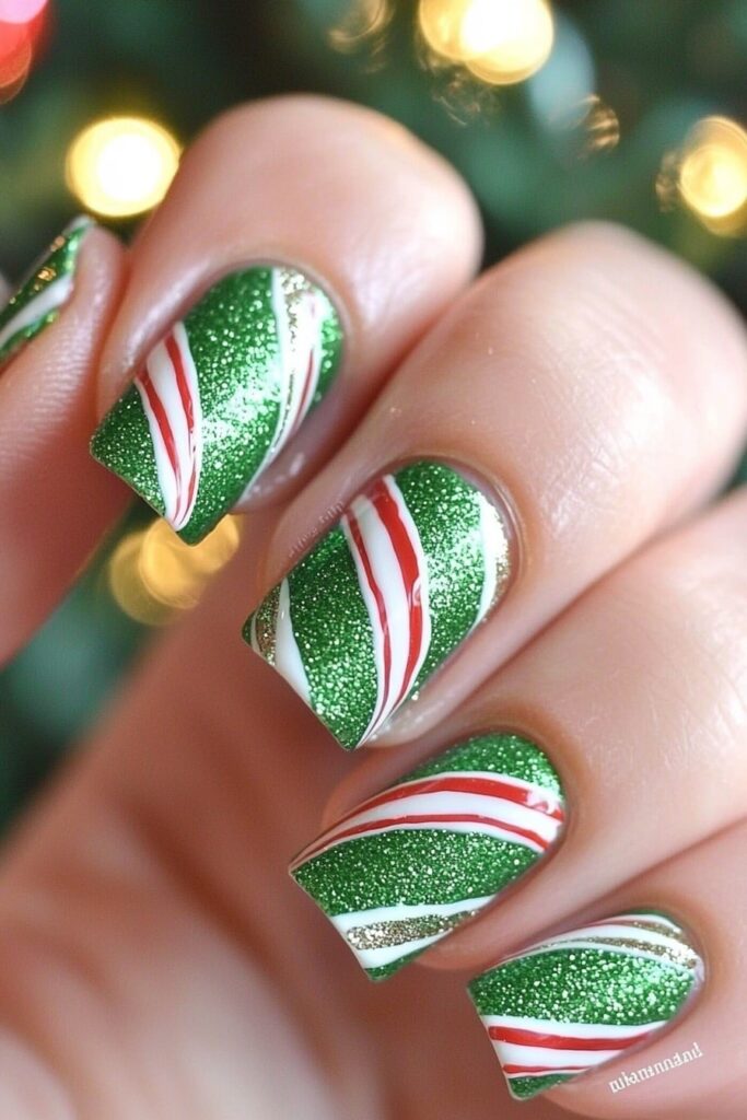 Emerald green glitter nails with candy cane stripe Christmas design