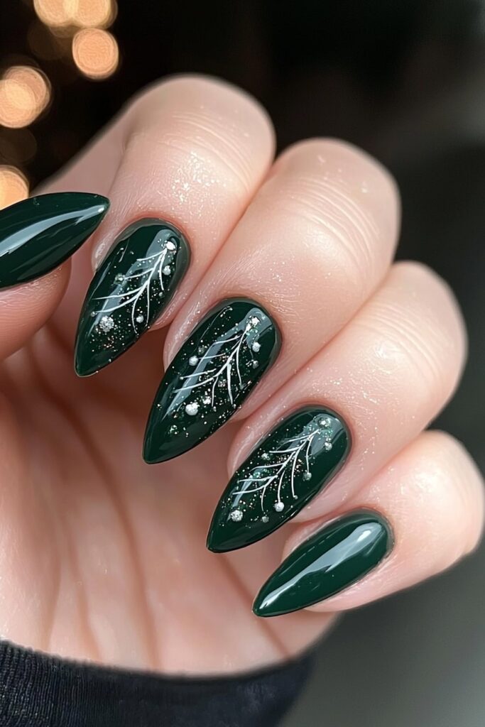 Emerald green Christmas nails with silver snowflake branch design