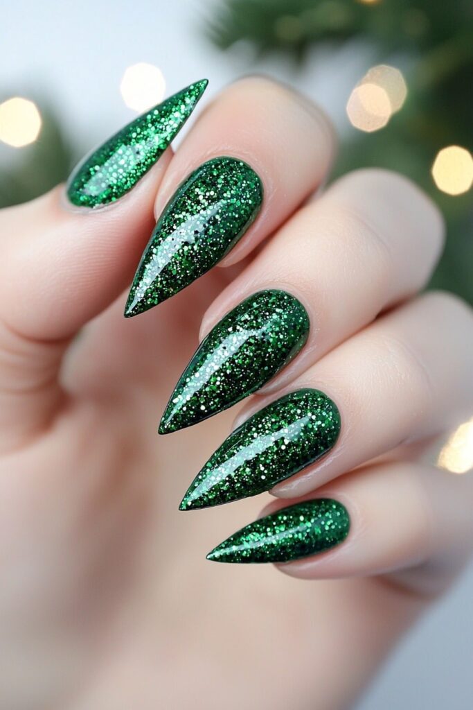 Sparkly emerald green stiletto nails with glitter for Christmas