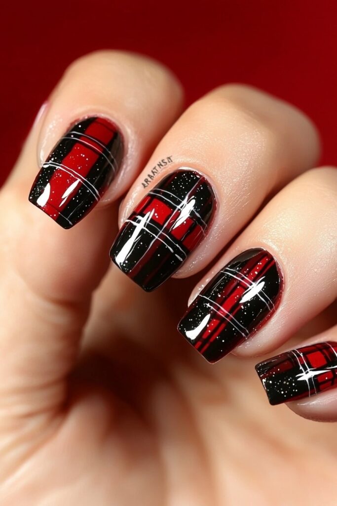 Red and black plaid Christmas nail design with sparkles