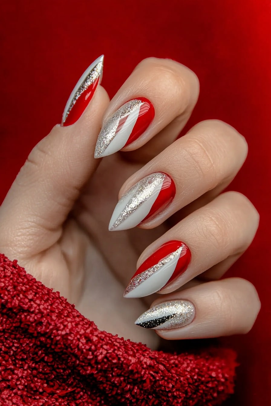 Simple classy Christmas nails featuring white, red and silver diagonal stripes