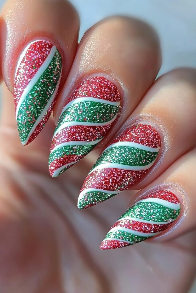 Peppermint swirl design in red and green Christmas nail designs