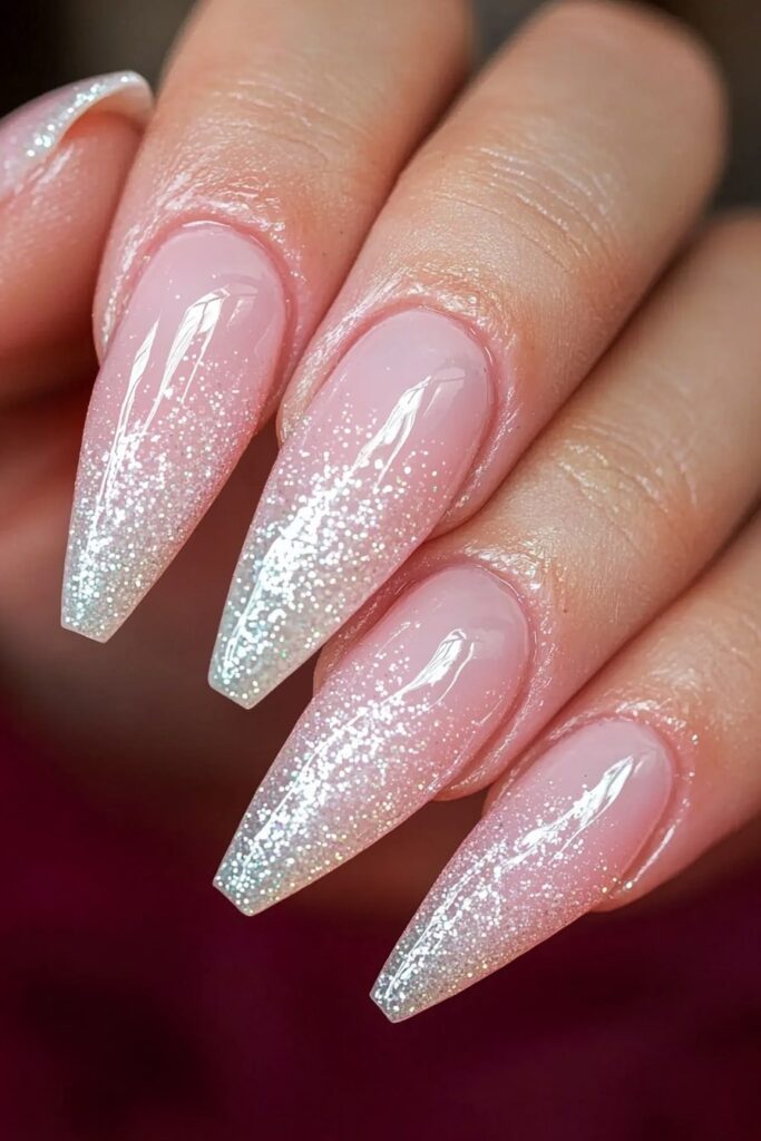 Pink Christmas nails with glittery silver ombre tips