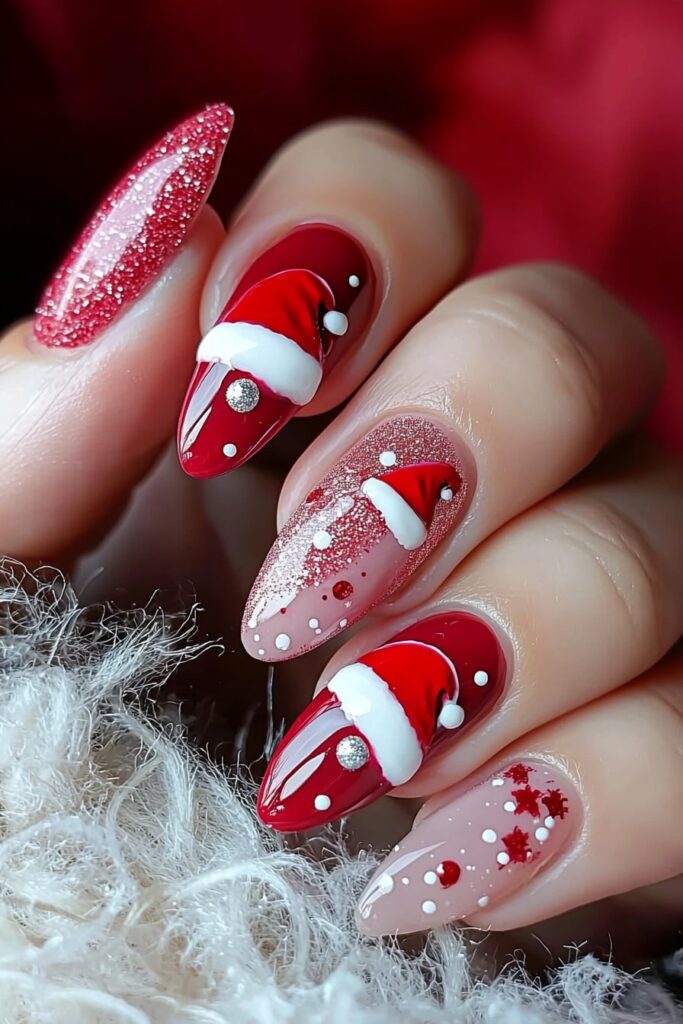 Pink and red Christmas nails featuring Santa hat designs