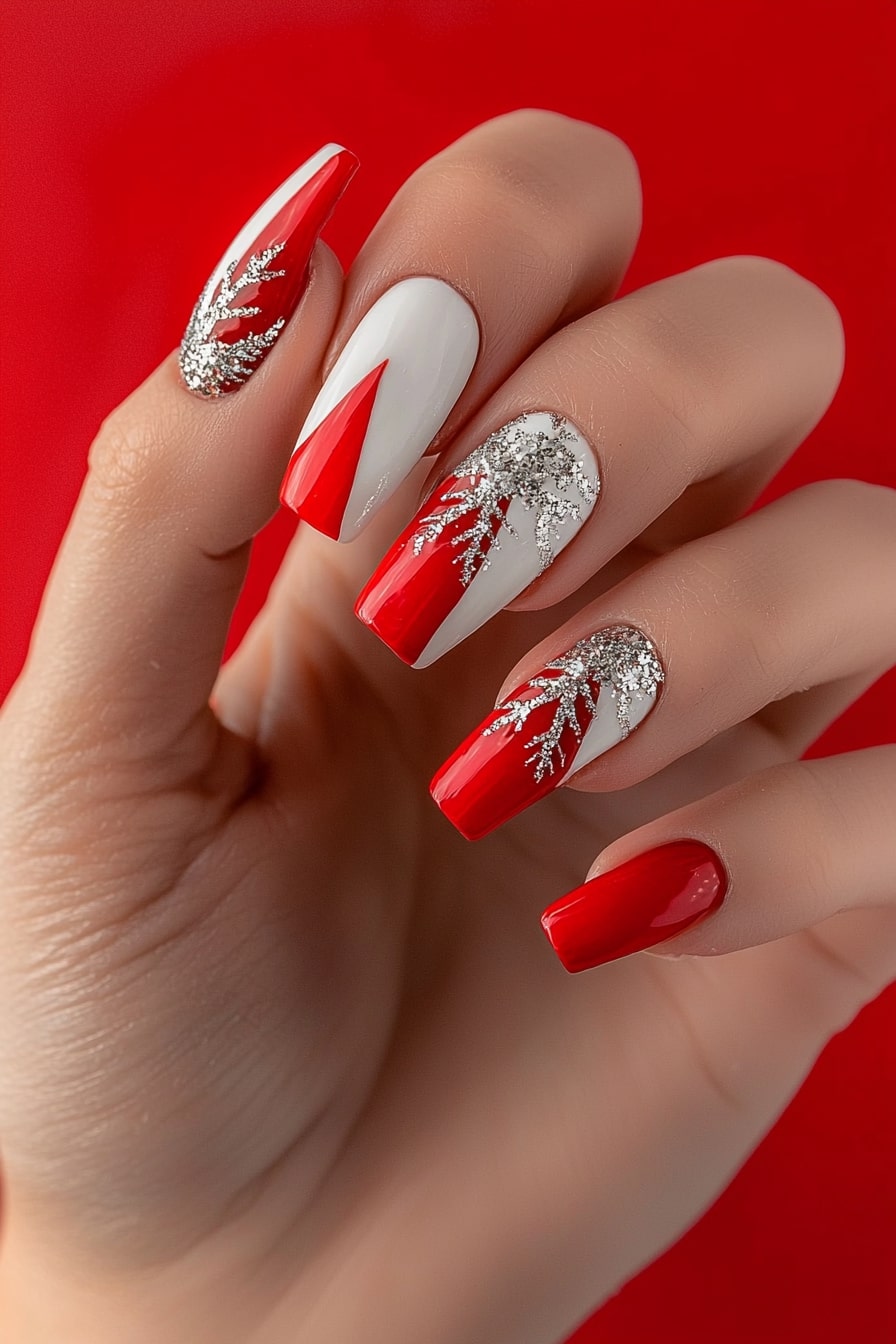 Red and white Christmas nails with glittery snowflake designs