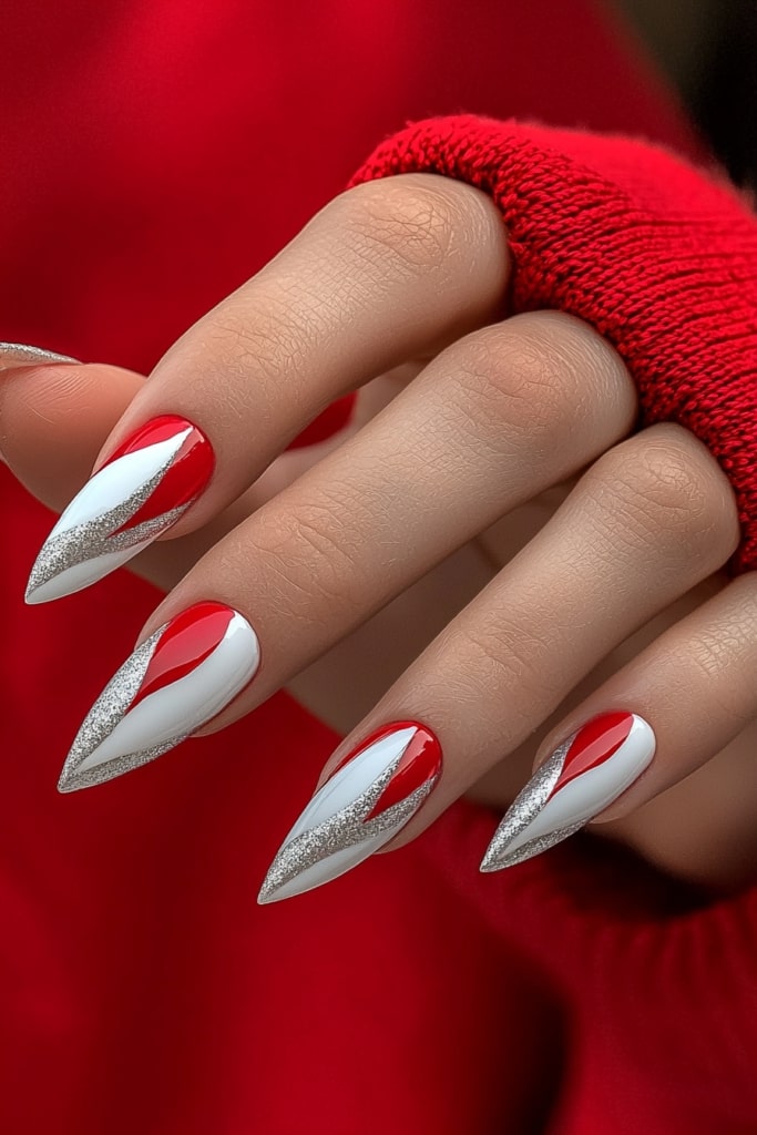 Red and white stiletto nails with silver glitter Christmas design