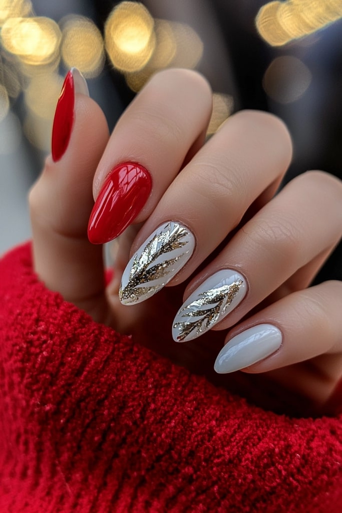 Pink and white Christmas nails with glittery leaf accents