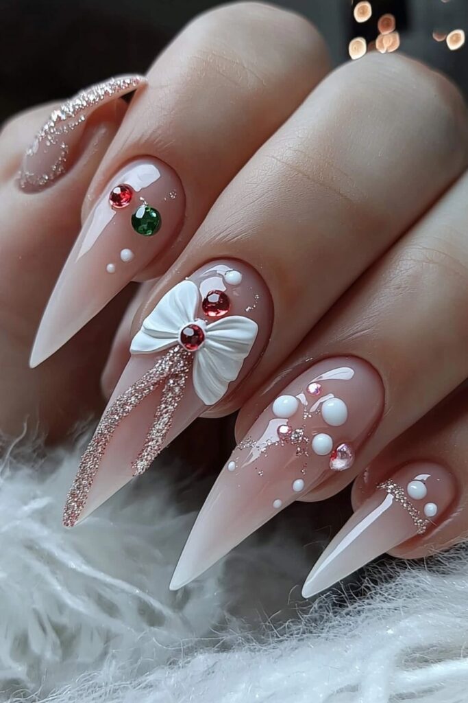 Christmas almond acrylic nails with white 3D bow and gems