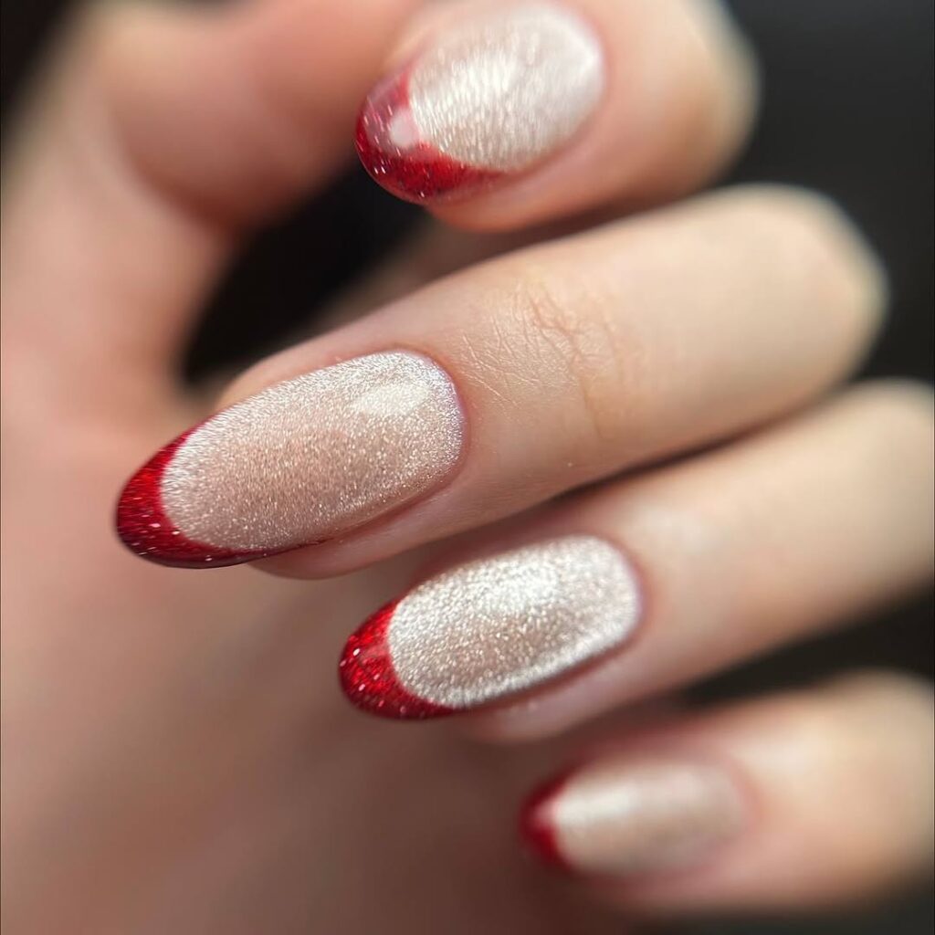 Sparkly white nails with red glitter French tips for Christmas