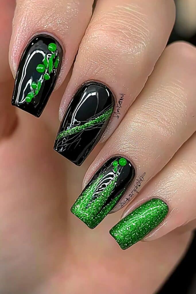 Wicked almond nails with black and emerald glitter broomstick design