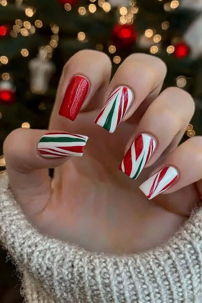 Short neutral winter nails featuring candy cane stripes