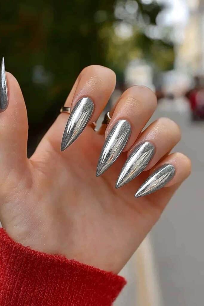 Metallic silver chrome wicked almond nails with pointed tips