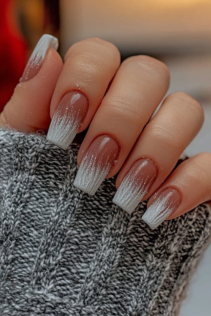 Frosted ombre nails blending winter hues.