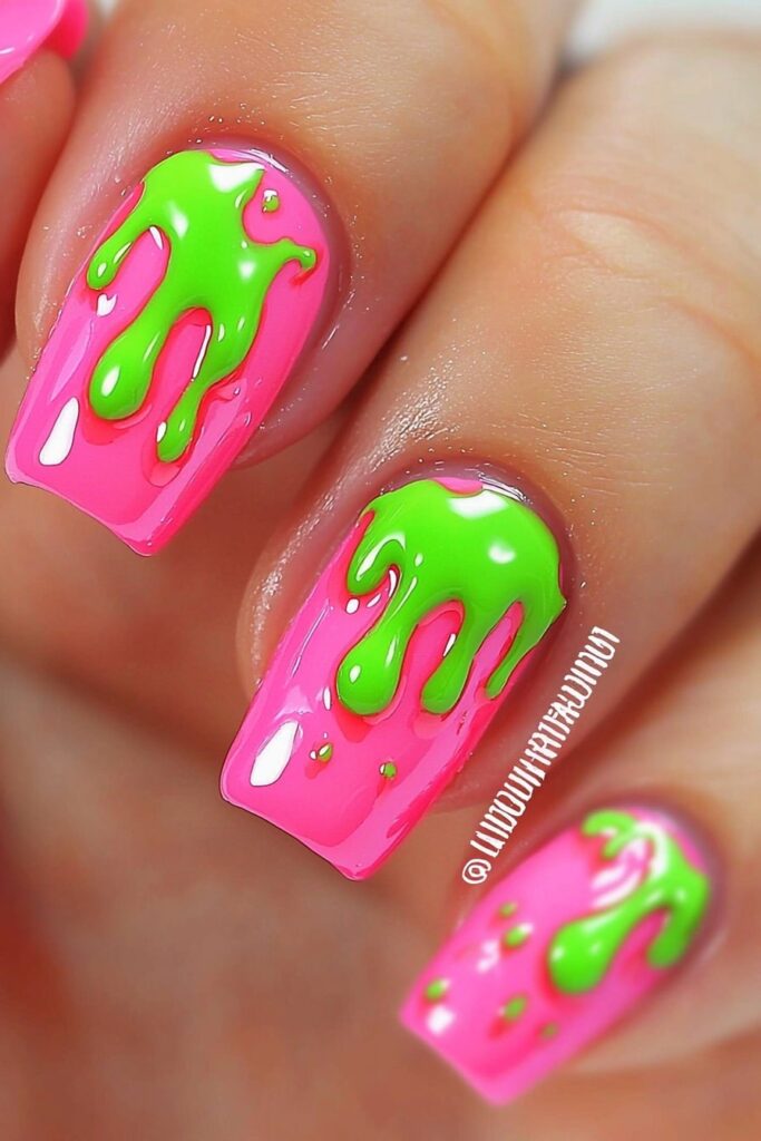 Wicked pink and green dripping slime nail design