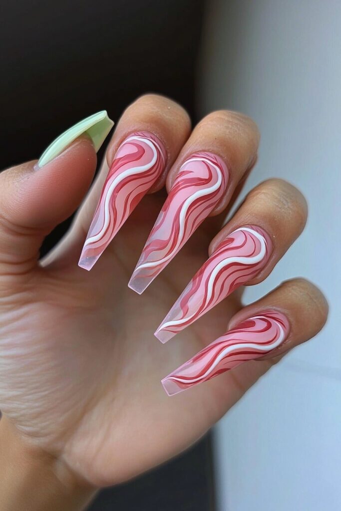 Wicked pink swirled marble design on long coffin nails