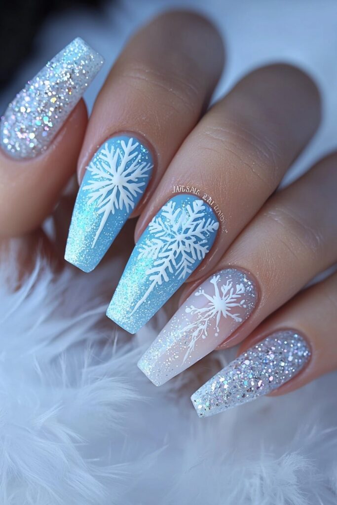 Coffin Christmas nails with icy blue snowflakes and glitter accents