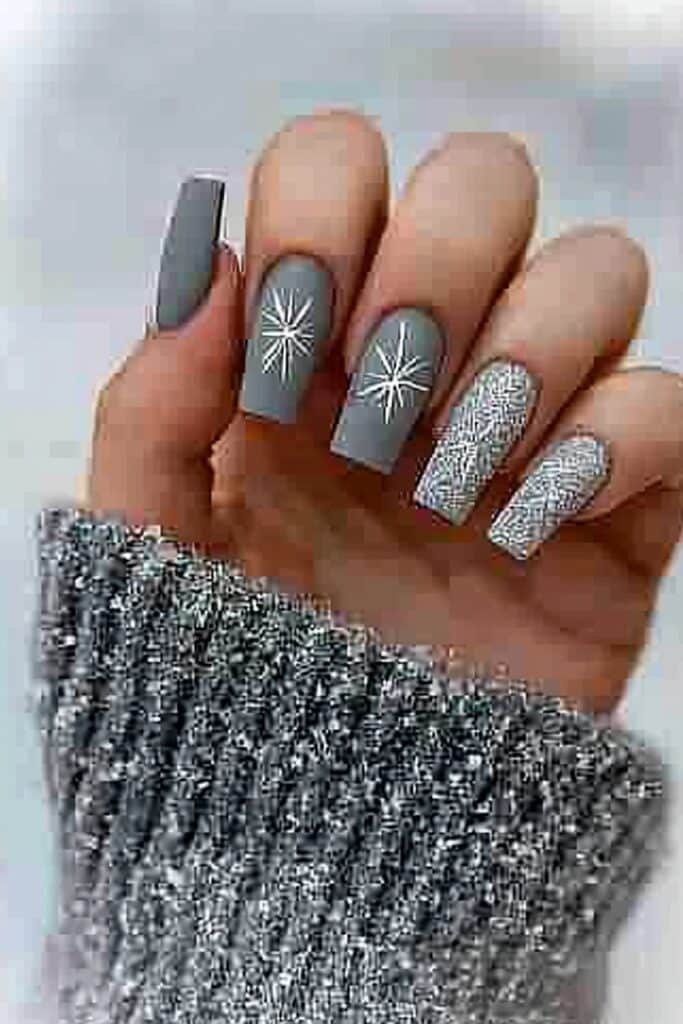 Short neutral winter nails with matte gray snowflakes"