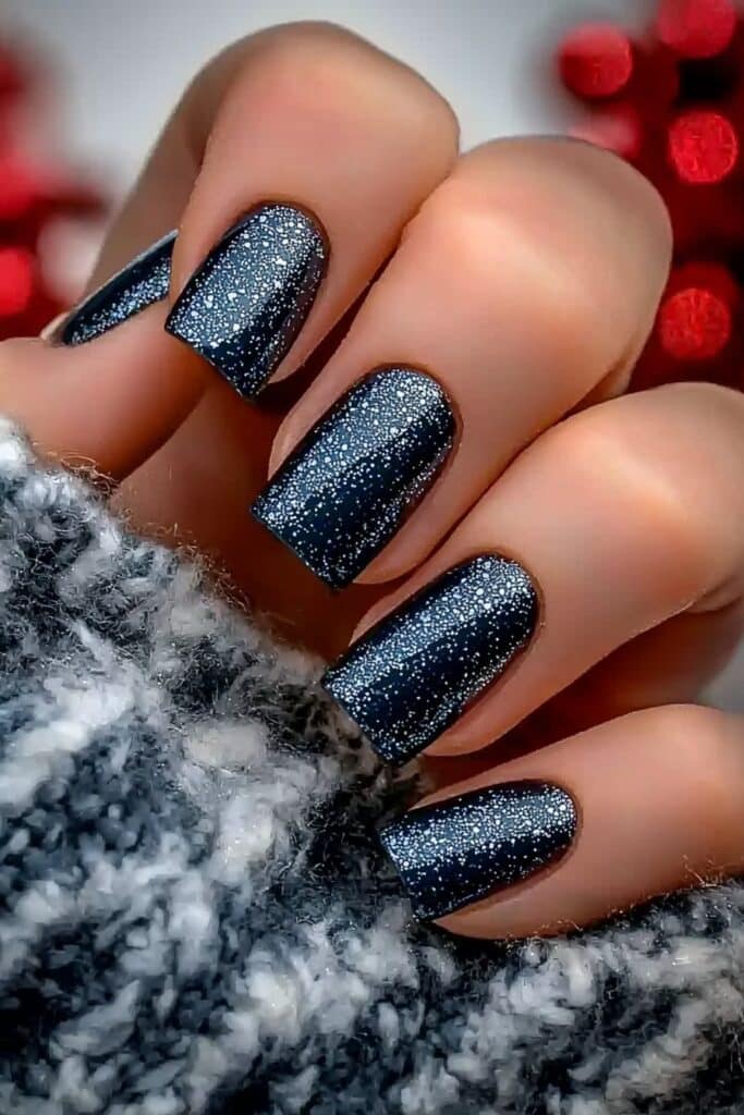 Short neutral winter nails in midnight blue shimmer