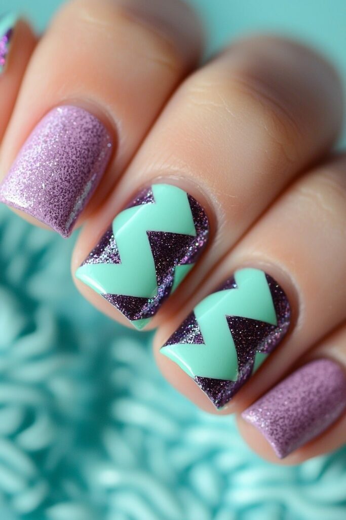 Mint green chevron pattern over sparkly purple nail design