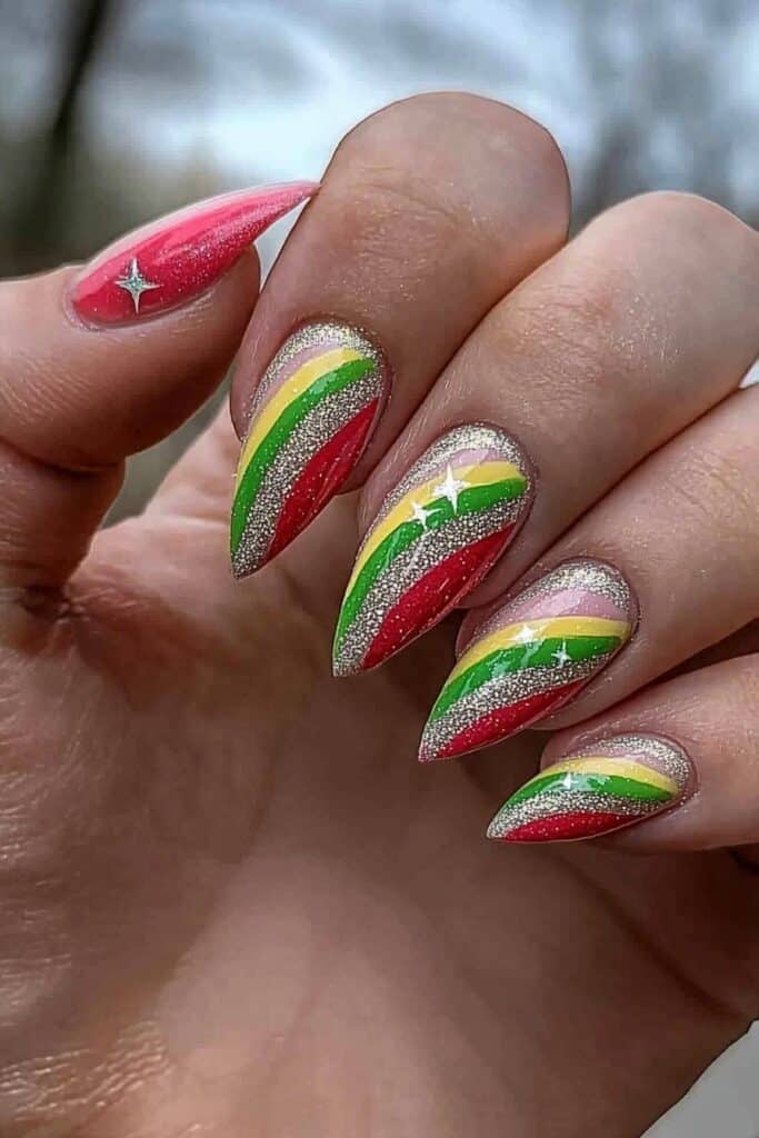 Almond wicked nails with glittery diagonal rainbow stripes design