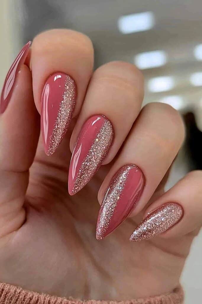 Pink wicked almond nails with diagonal rose gold glitter strips