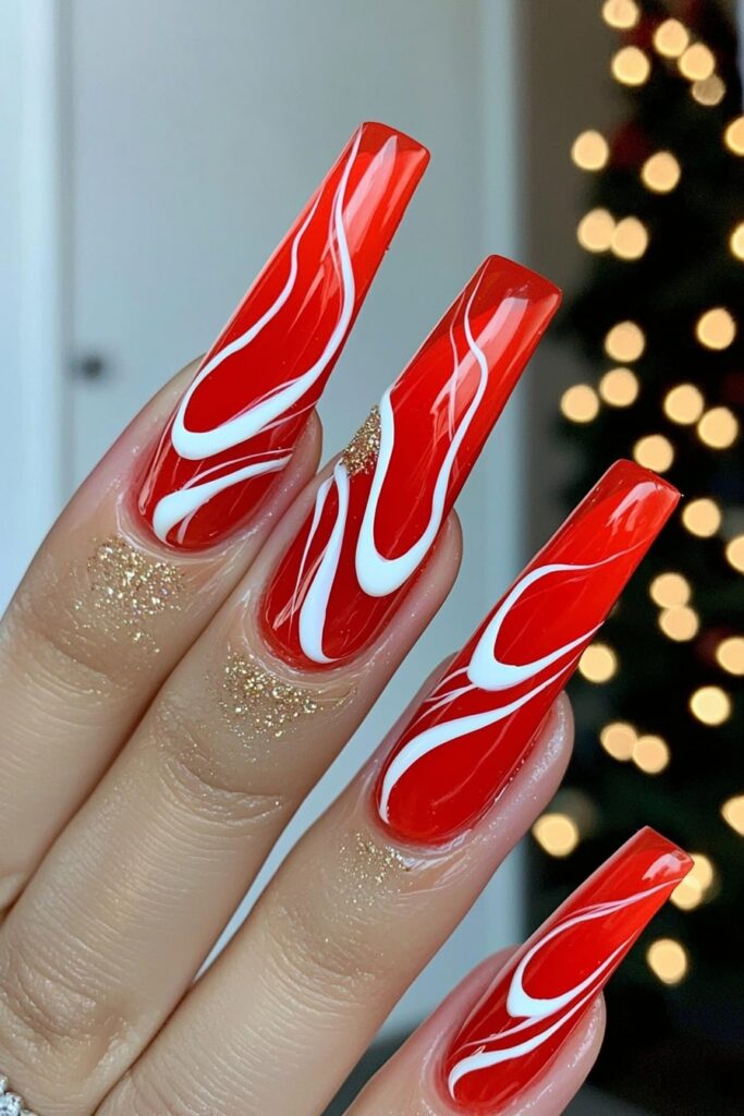 Christmas red acrylic nails with white swirled marble design