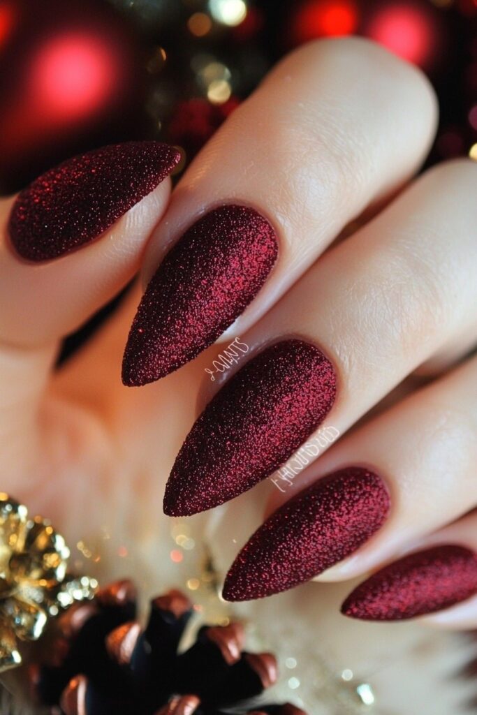 Christmas red acrylic nails with matte finish and gold accents