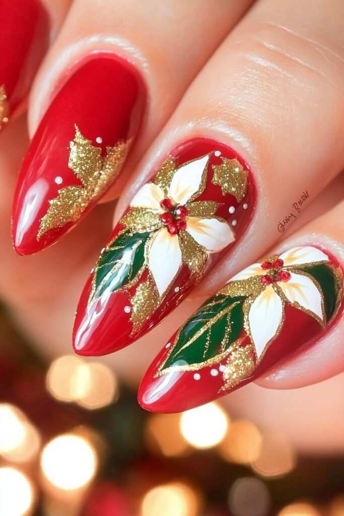 Christmas red acrylic nails with gold glitter poinsettia flowers