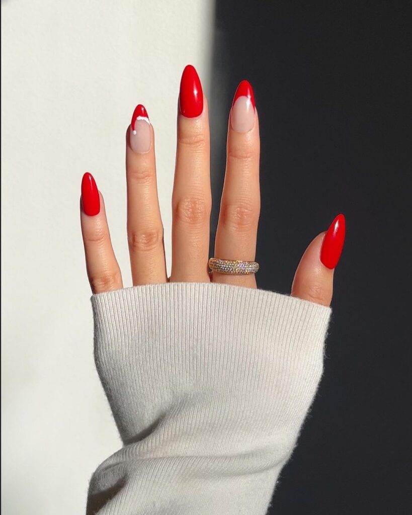 Christmas acrylic almond nails with red Santa hat-inspired French tips