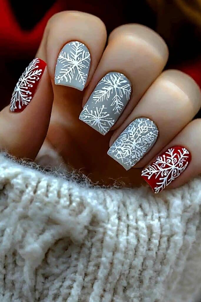 Short neutral winter nails with nude snowflake stamps