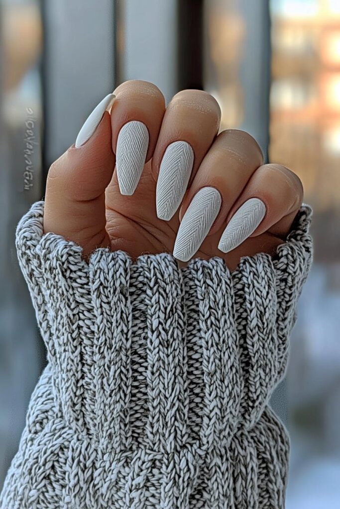 Almond-shaped nails in snowy neutral shades