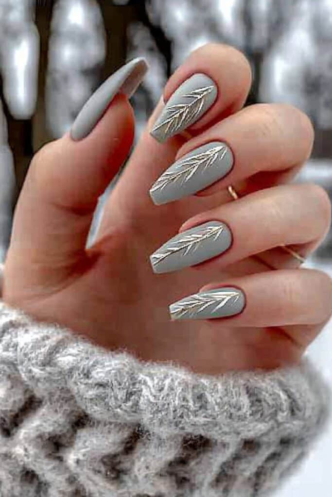 Elegant gray nails with a subdued winter theme.