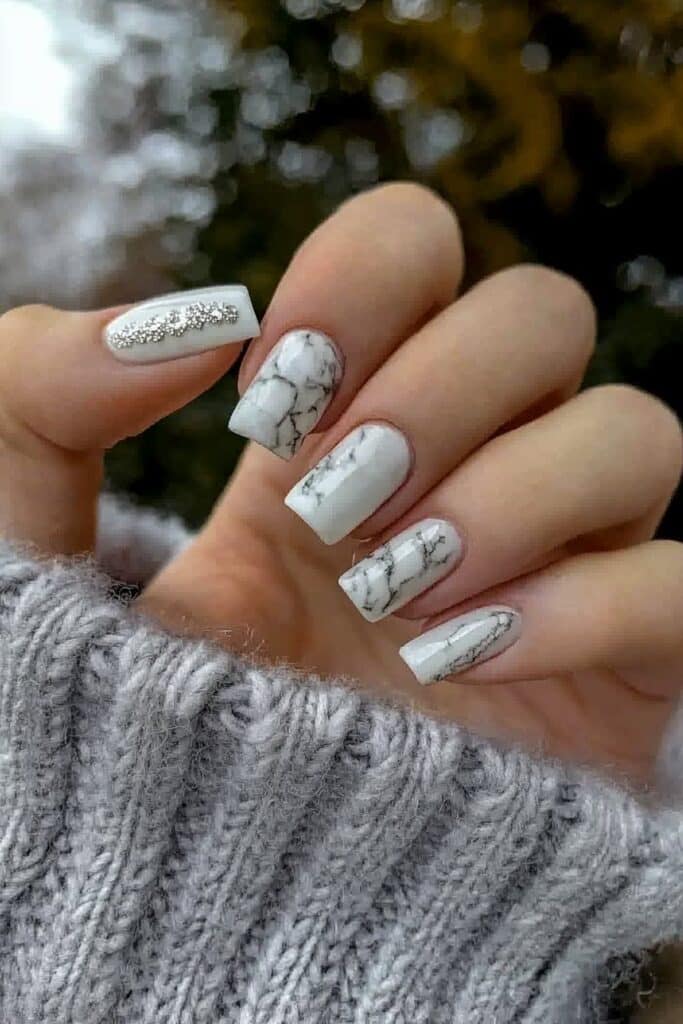 Short neutral winter nails with white marble effect