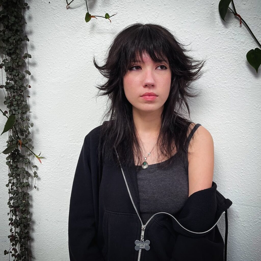 Wispy long hair wolf cut with light, airy layers and movement