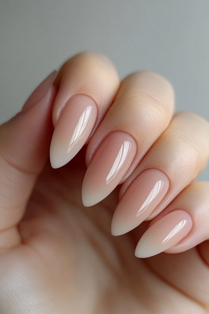 A soft and elegant summer nail design featuring pastel ombre acrylic nails, blending delicate shades seamlessly from tip to base. The gradient effect creates a dreamy, airy vibe