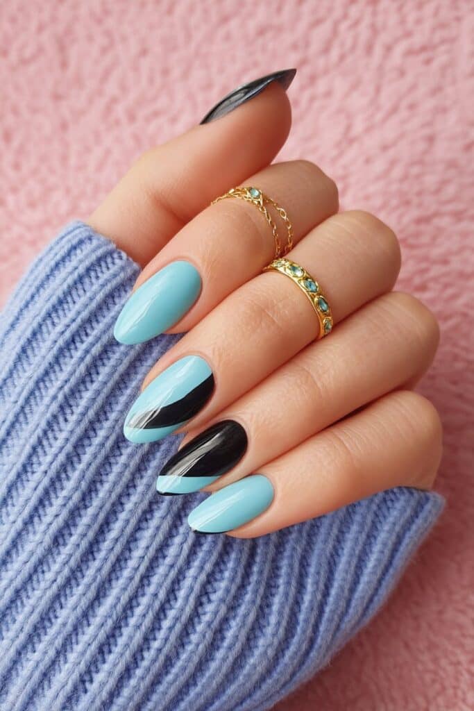 Striking summer nails featuring bold teal and deep black geometric patterns, offering a modern, edgy statement with high-gloss acrylic finish.