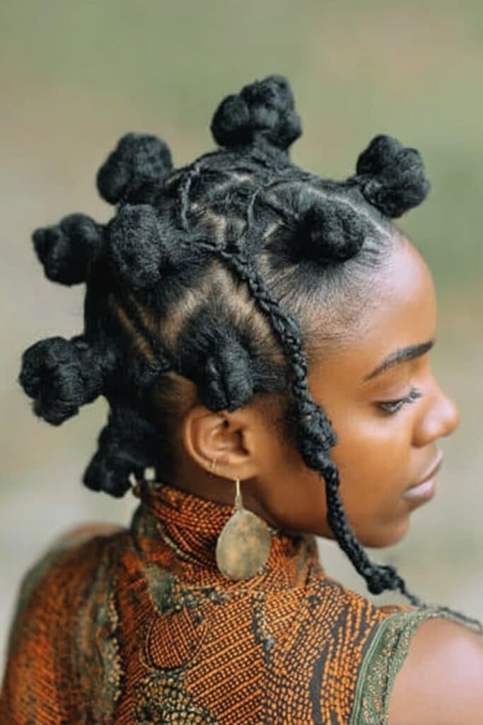 Small sections of hair twisted tightly and wrapped into small knots across the scalp, creating a distinctive geometric pattern of raised coils.