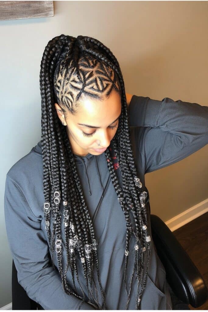 Chunky protective braids that begin without a knot at the root, creating a more natural hairline appearance with thick, substantial braids.