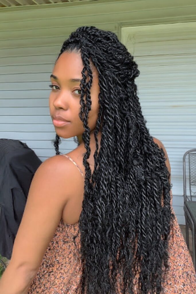 Smooth, rope-like protective style created by twisting synthetic hair with natural hair, resulting in uniform, sleek twists that hang freely.