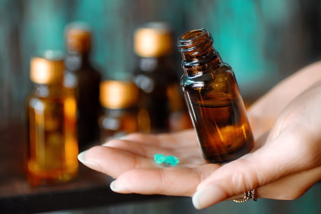 Educational display of essential oil bottles with warning symbols and information cards about safe usage practices.
