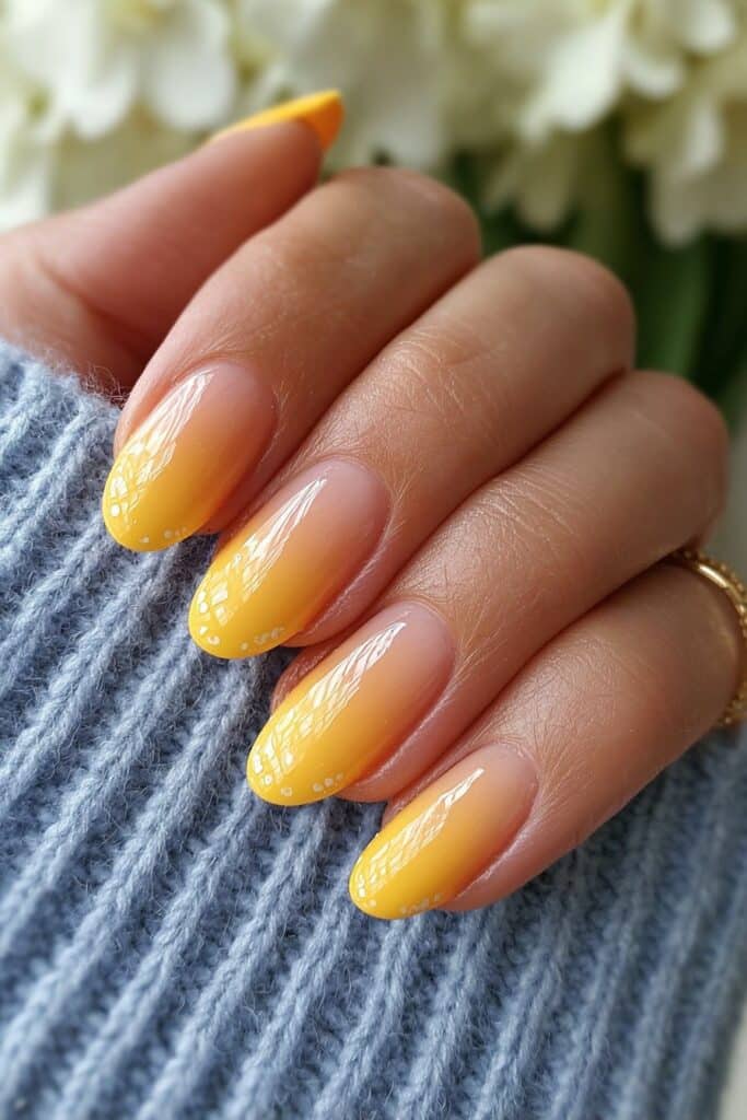 Modern orange French tips featuring bold tangerine color with sharp geometric cut angles for contemporary edgy nail style.