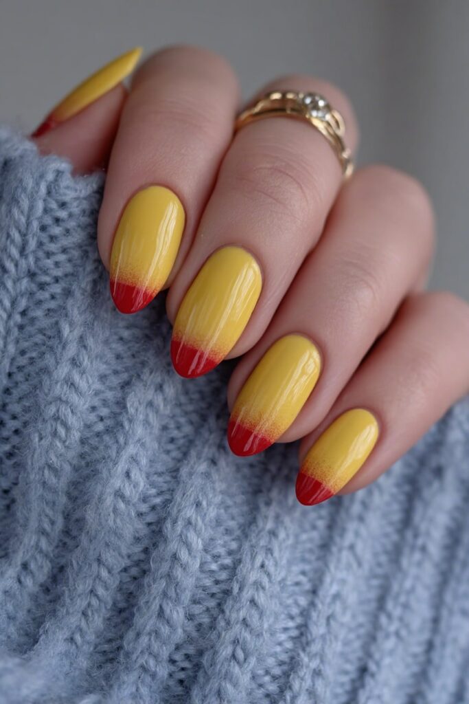 Fun back to school nails styled like crayons with bright red and yellow tips and sharp clean lines.

