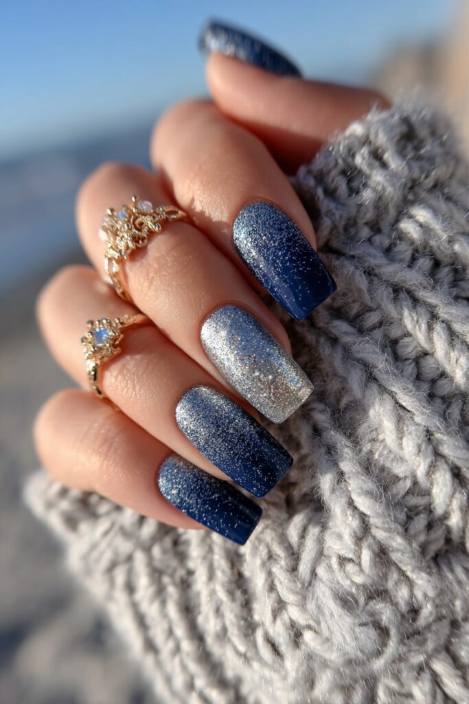 Bold navy blue and silver chrome nails for a sleek and elegant beach evening look.