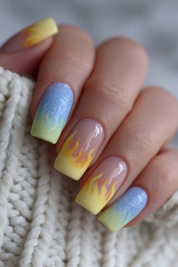Bold back to school nails featuring multicolored rainbow flame tips for an artsy classroom look.