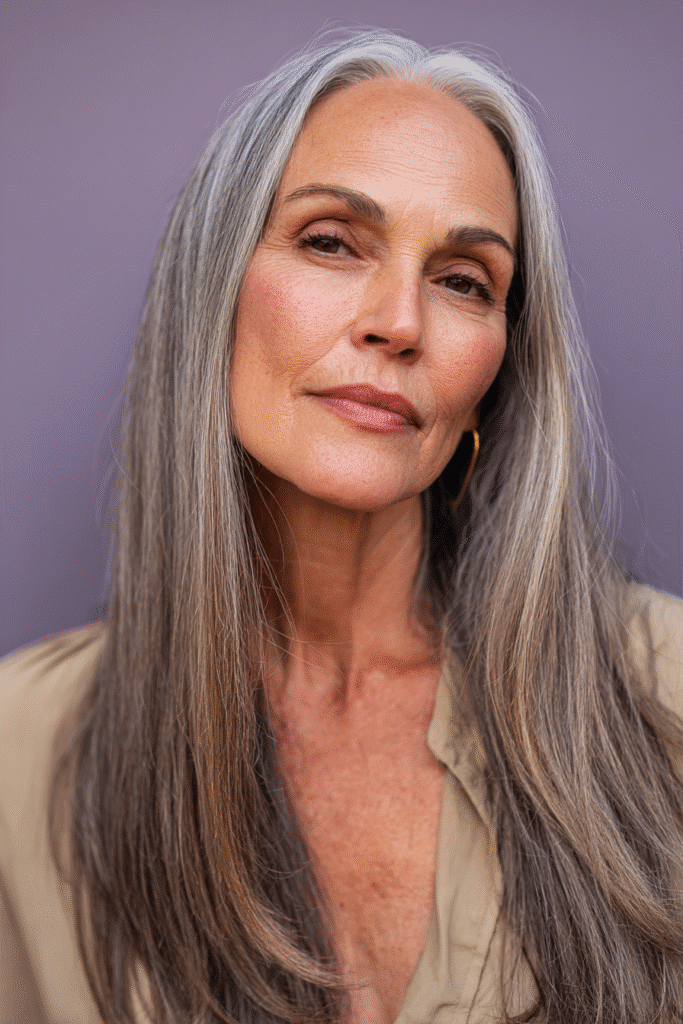 A sharp, even blunt cut designed for mature women, giving a clean, sophisticated look. The lighting emphasizes the smooth ends and precise shape of the haircut.